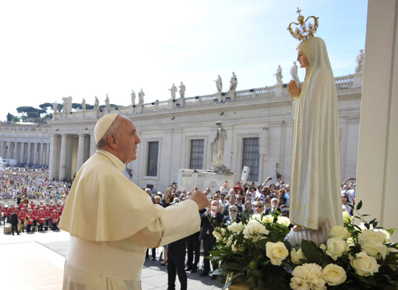 Pope Francis prays in front of statue of Our Lady of Fatima during general audience in St. Peter’s Square at Vatican